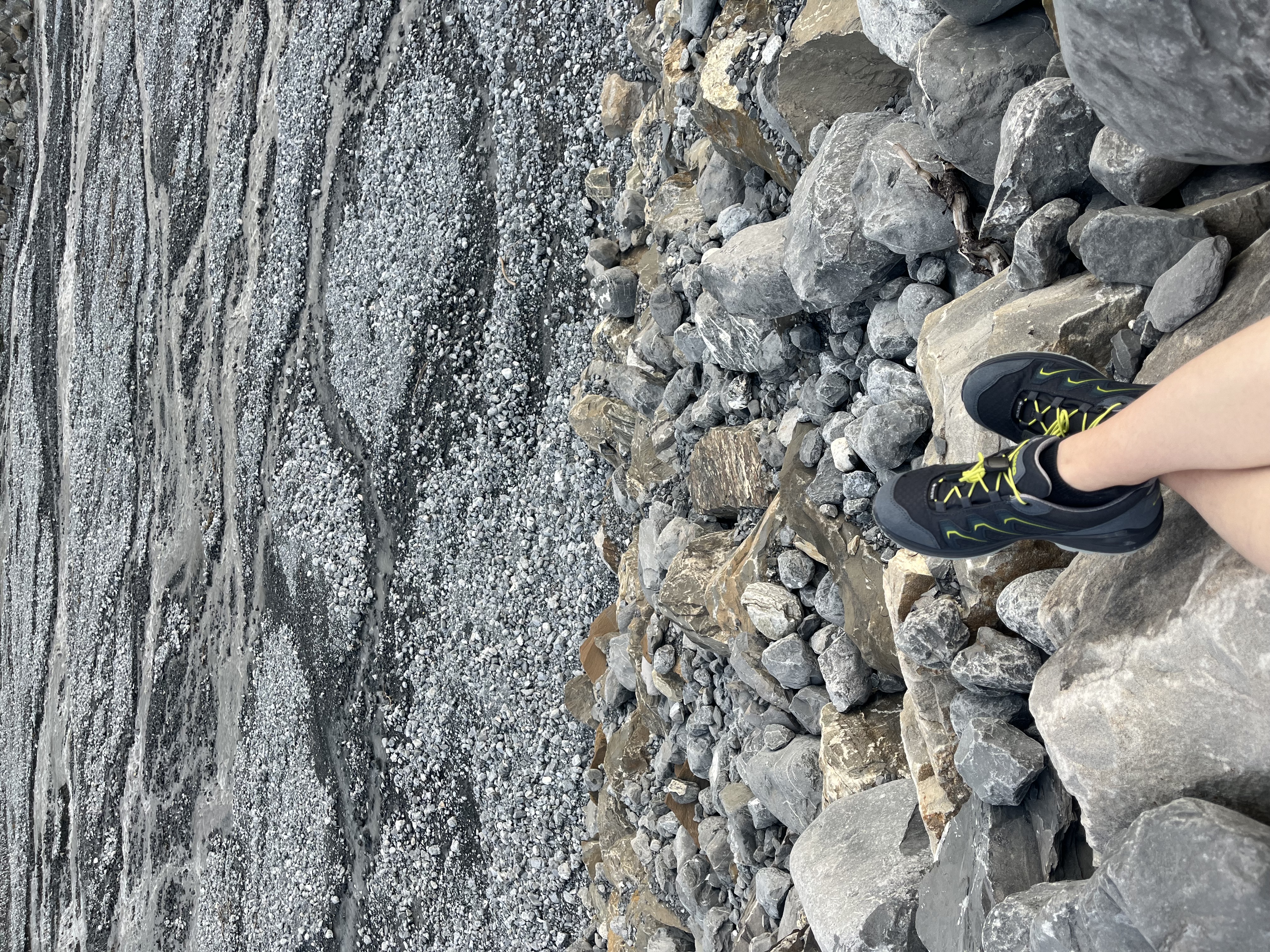 Geological rock striations and hiking boots