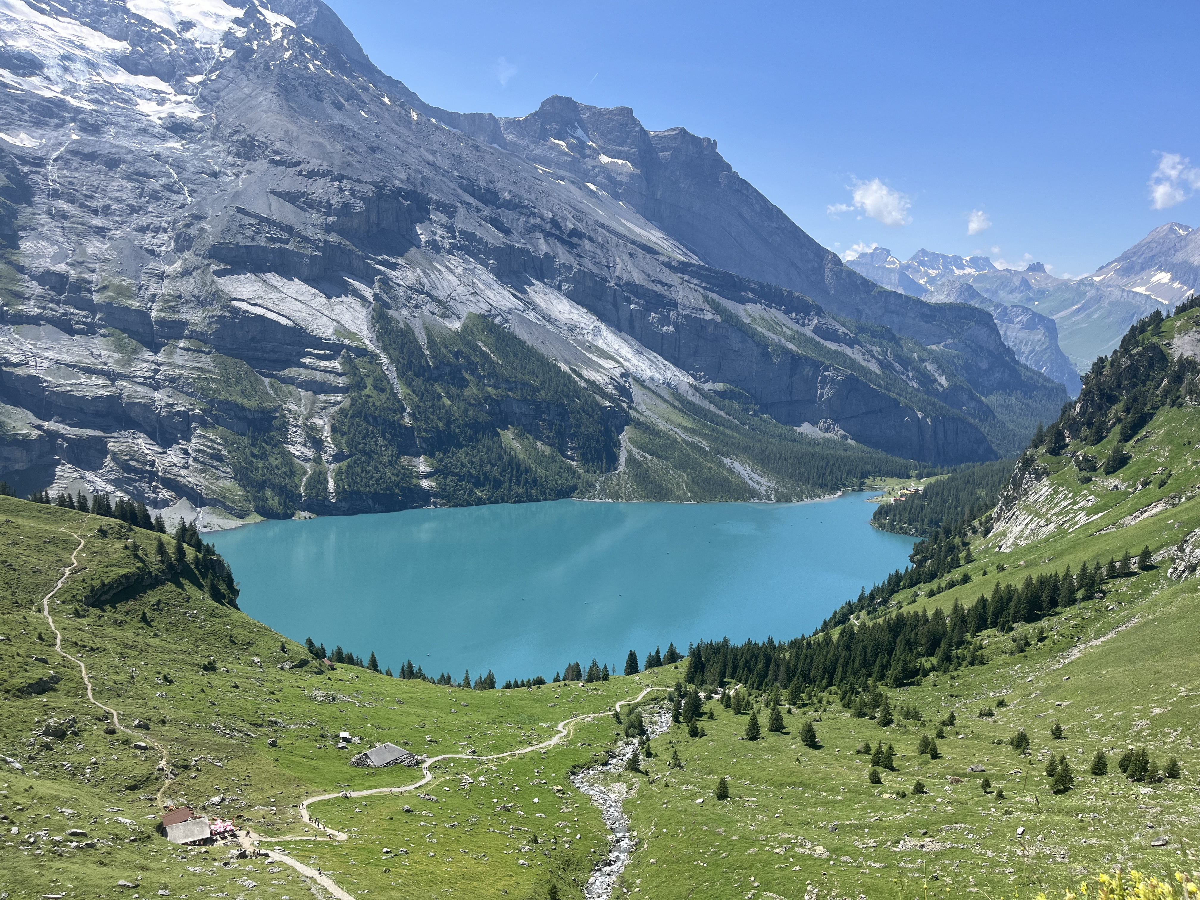 Oeschinensee panorama from high above with meadow trails